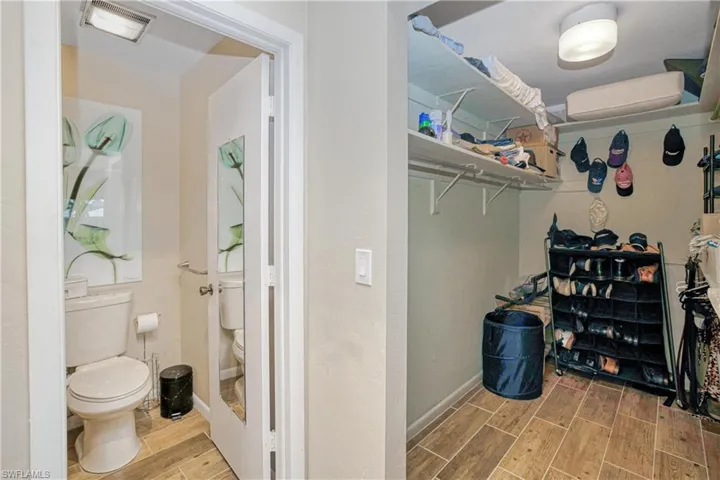 Walk in closet featuring wood tiled floors