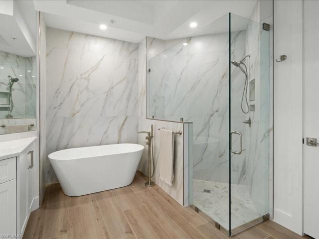 6' stand alone tub with walk in tiled shower