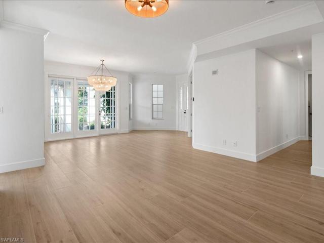 Open family/dining area with hallway to guest bedroom and bath
