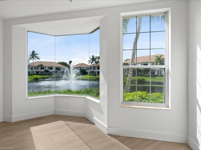 lake fountain view from primary bedroom