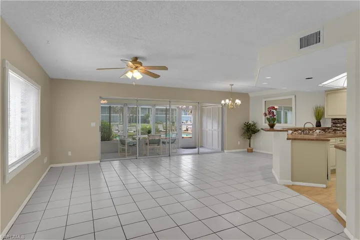 Step inside to a BEAUTIFULLY REMODELEDINTERIOR featuring MODERN TILE FLOORINGand updated plumbing (RE-PIPED)