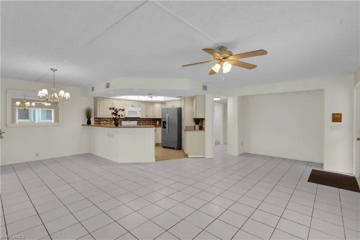 Step inside to a BEAUTIFULLY REMODELEDINTERIOR featuring a REPLACED ELECTRICALPANEL, NEWER APPLIANCES W/ STAINLESSSTEEL REFRIERATOR/FRIDGE, a NEWERWATER HEATER & A/C, and HURRICANEIMPACT FEATURES for added SECURITY &COMFORT