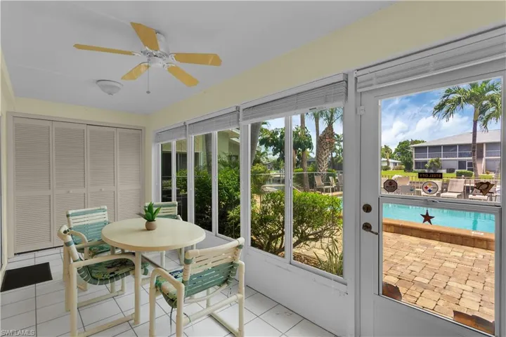 The GLASS PORCH NORTH-FACING LANAIoffers POOL VIEW and VIEW of theINTERSECTING CANAL - YOUR PERSONALRETREAT to enjoy TRANQUIL SUNRISES andSUNSETS!