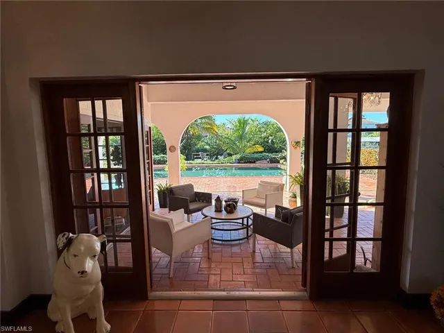 Doorway to outside with tile patterned floors and french doors