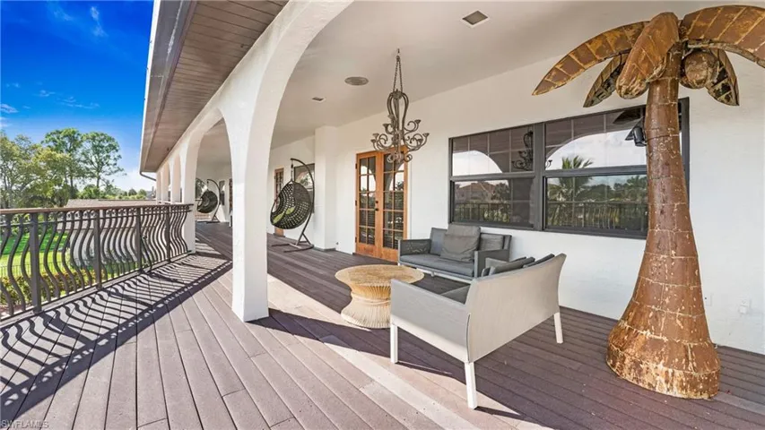 Wooden deck with french doors and outdoor lounge area