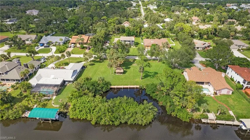 Aerial perspective of suburban area with a large body of water