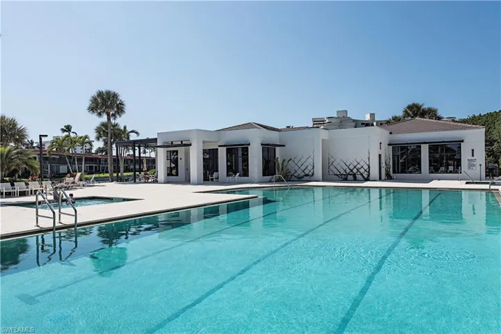 Community pool with a patio