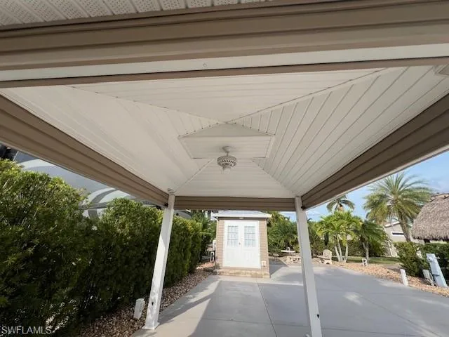 View of patio / terrace featuring a gazebo and a shed