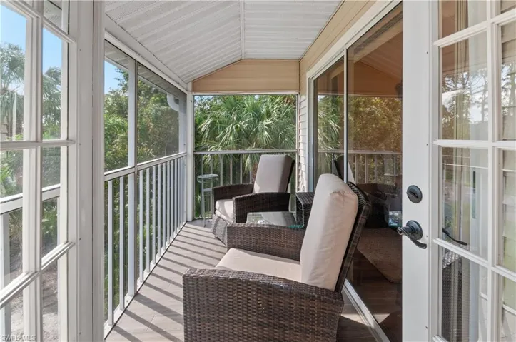 Sunroom / solarium with lofted ceiling