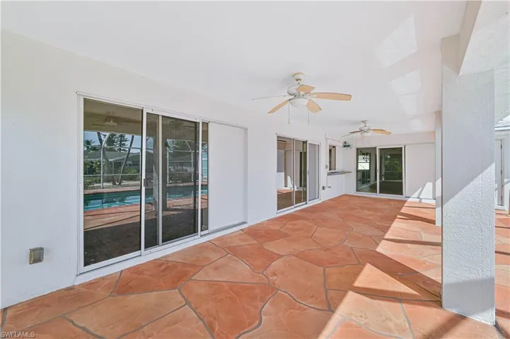 View of patio featuring ceiling fan