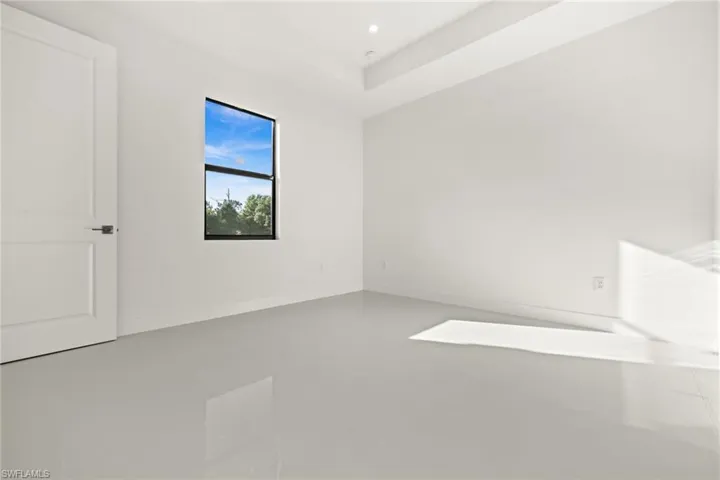 Unfurnished bedroom with baseboards