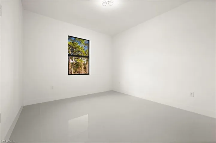 Unfurnished room featuring baseboards