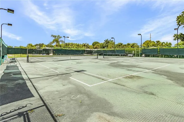 Two hard-surface tennis/pickleball courts featuring perimeter fencing.
