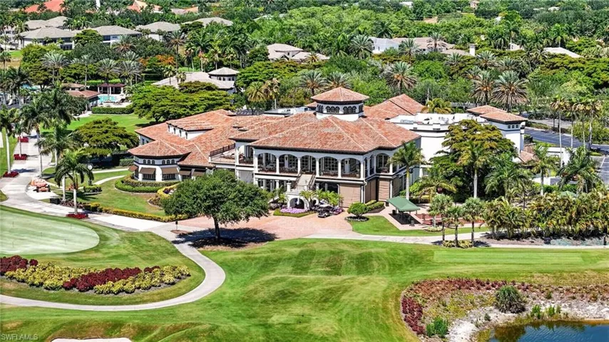 Grand structure featuring a multi-level design with a terracotta tile roof and extensive landscaping