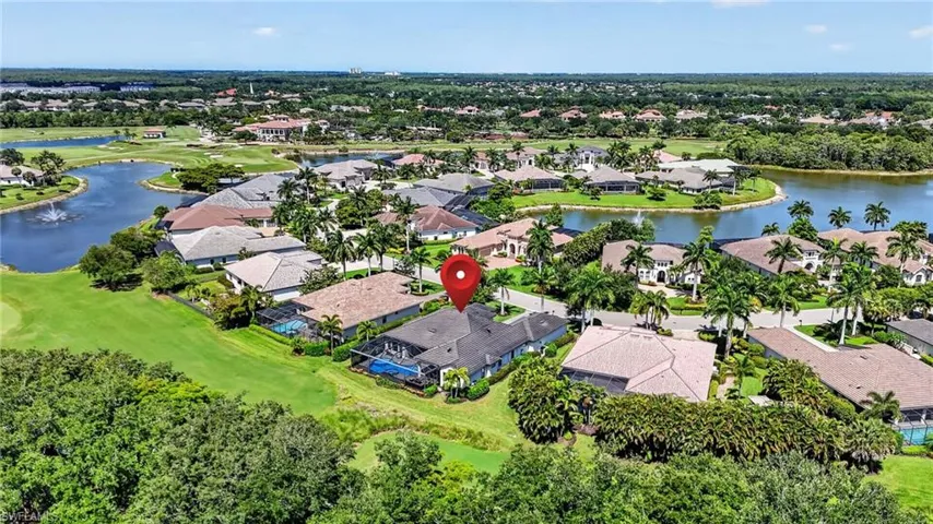 Aerial property showcasing a private pool and screened lanai