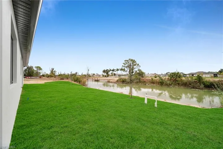 View of yard with a water view