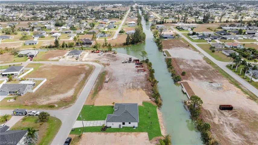 Drone / aerial view featuring a water view and a residential view