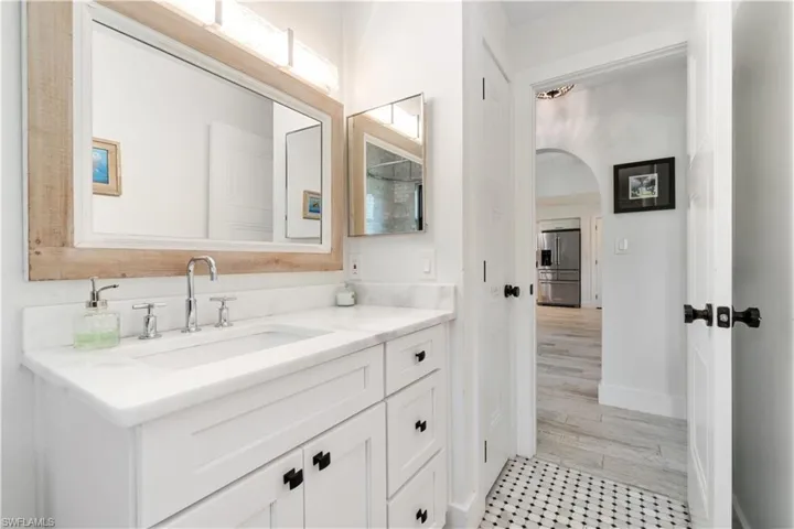 Bathroom featuring vanity and hardwood / wood-style floors