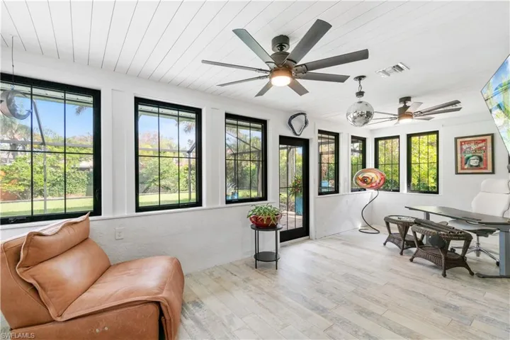 Sitting room featuring ceiling fan and light hardwood / wood-style flooring