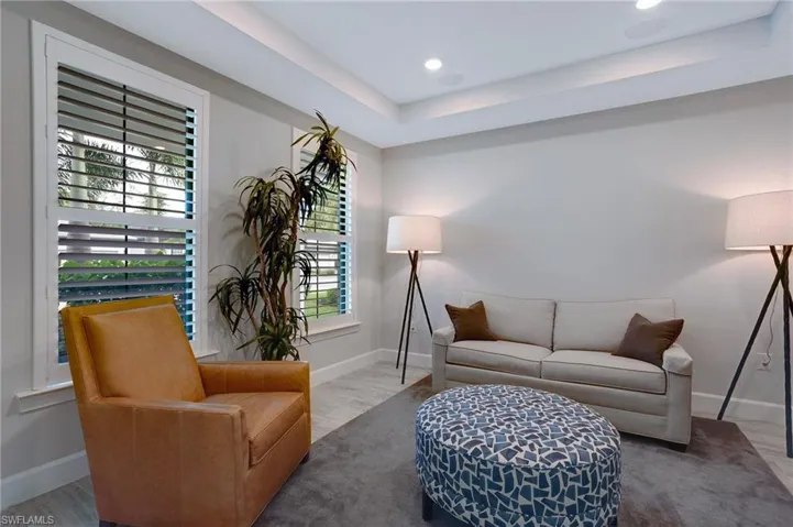Living room with recessed lighting and wood finished floors