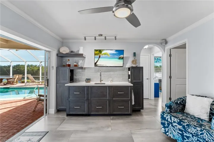 Your morning kitchen has access to your lanai and pool area! Beautiful backsplash a drawer refridgerator and freezer in the built ins!