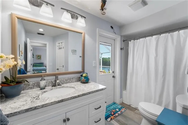 3nd full bathroom serves as a pool bath as well! Beautiful granite vanity countertops!