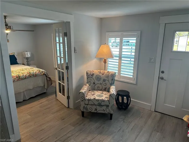 Entryway with wood finished floors, ceiling fan, and healthy amount of natural light