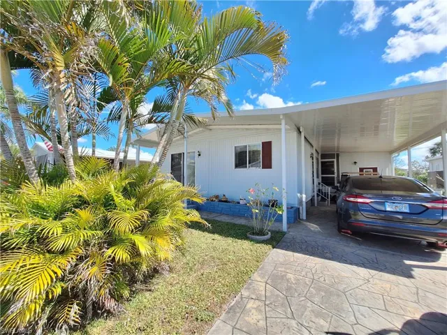 View of front of home with a carport