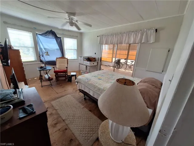 Bedroom featuring ceiling fan and wood finished floors