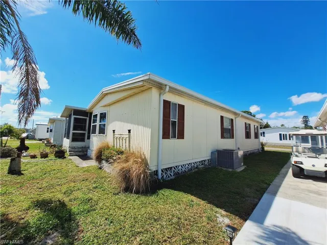 View of property exterior with crawl space, a lawn, a sunroom, and central air condition unit