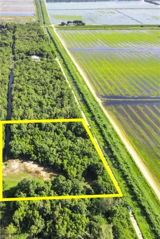 Birds eye view of property with a rural view