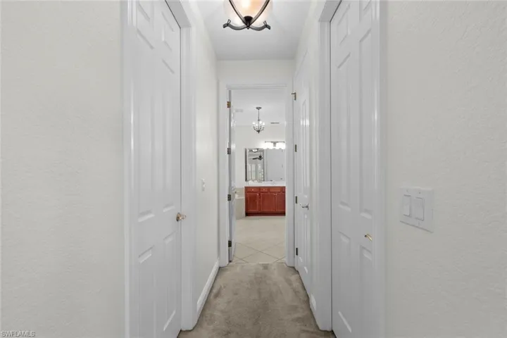 Hall to primary en-suite bath