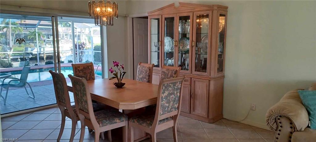 Dining Area has pocketing sliding glass doors overlooking the pool