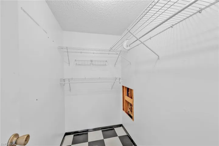 Spacious closet featuring tile patterned floors