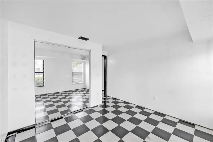 Empty room with tile patterned floors