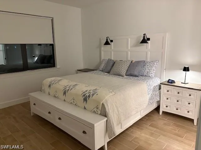 Bedroom featuring wood tiled floors