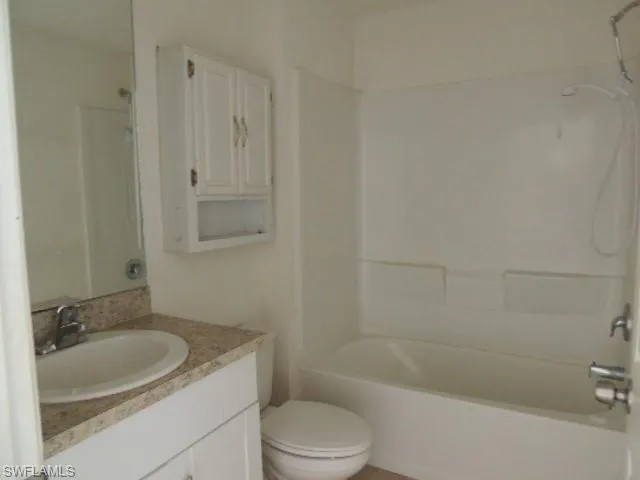 Full bath featuring  shower combination and vanity