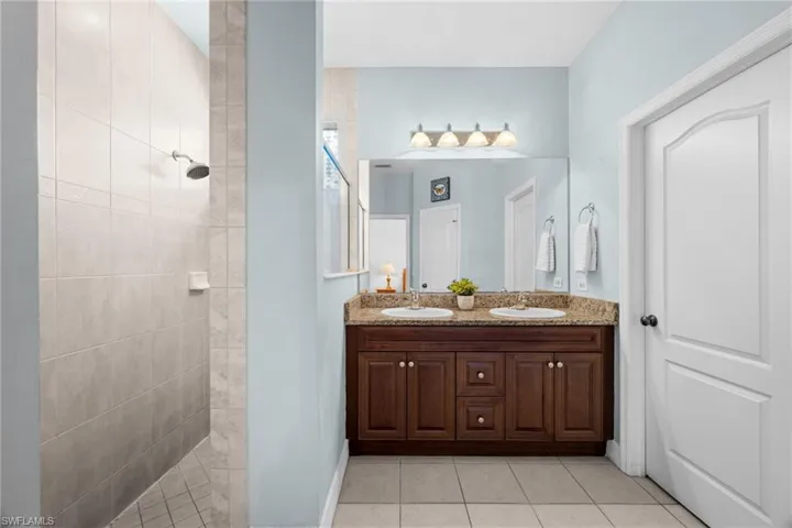 Master Bath with Dual sinks and tiled shower