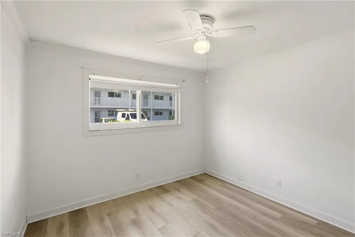 Guest bedroom with new flooring view #1