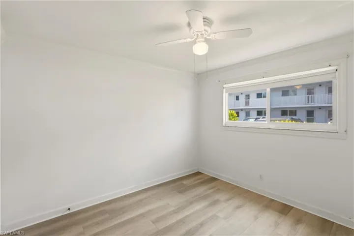 Guest bedroom with new flooring view #2