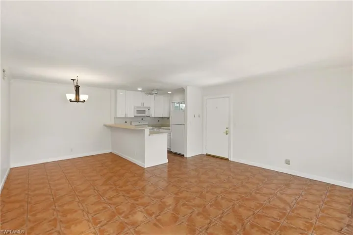 Living room, dining area and kitchen