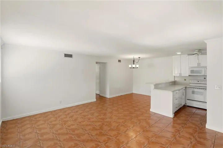 Living room, dining area and kitchen