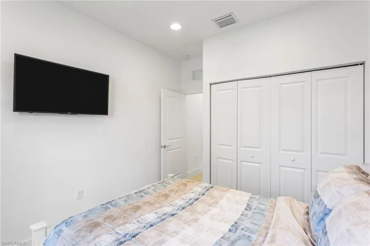 Bedroom with a closet and recessed lighting
