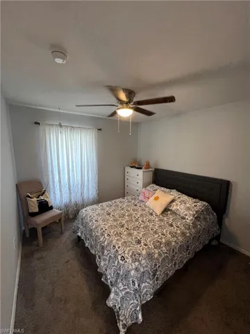 Bedroom featuring carpet and a ceiling fan