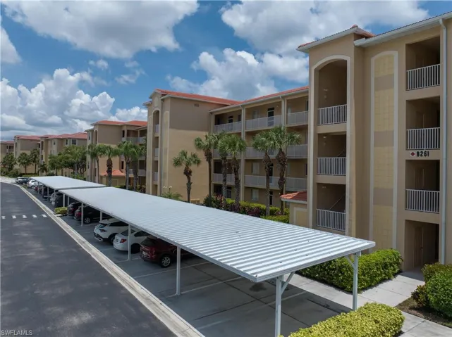 View of building exterior & covered parking