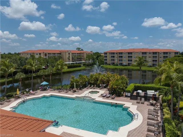 View of swimming pool, spa, pool deck area.