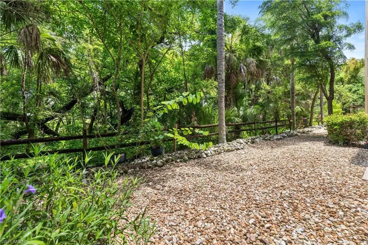 View of wooded/whisky creek from private screened-in lanai