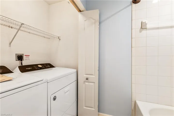 Laundry room featuring independent washer and dryer