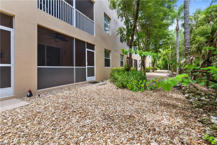 View of back entrance/green space area into private lanai