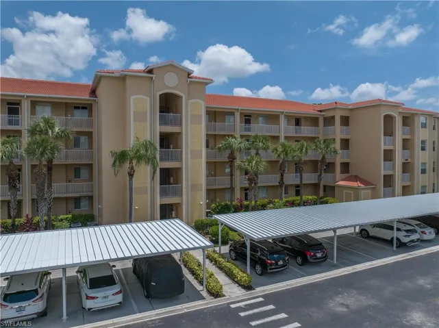 View of building exterior & covered parking structures